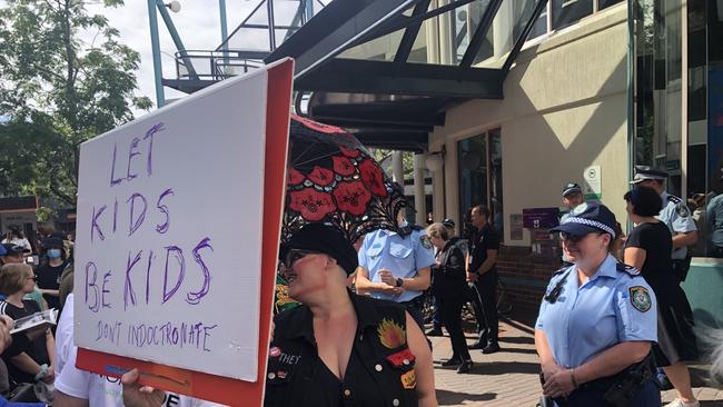 Police guarding the front of Manly Library as families arrive for Drag Queen Story Time, a World Pride linked event hosted by Northern Beaches Council in Sydney that attracted protesters. Picture: Jim O'Rourke