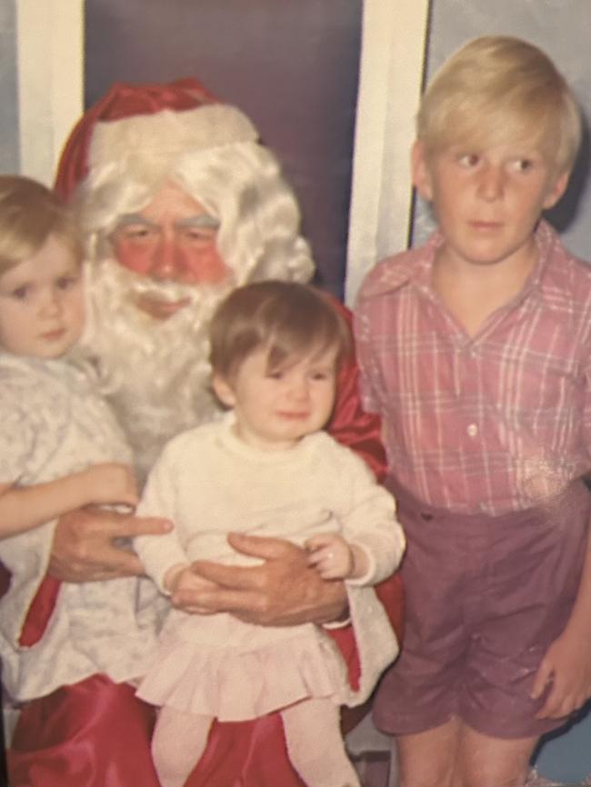 Phillip Powell (on right) with his siblings visiting Santa when he was 11 years old. Picture: Supplied by family