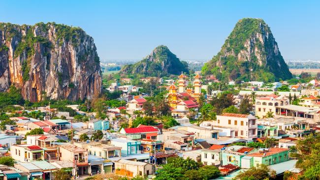 Marble Mountains overlooking Da Nang city.