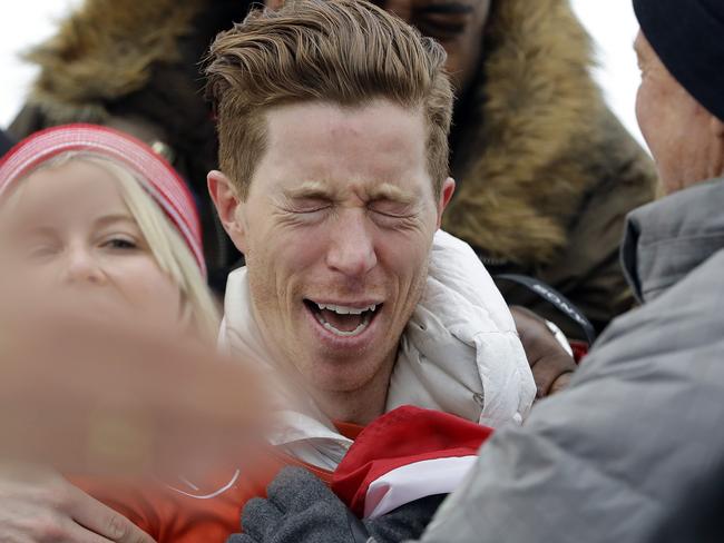 Shaun White, of the United States, celebrates winning gold