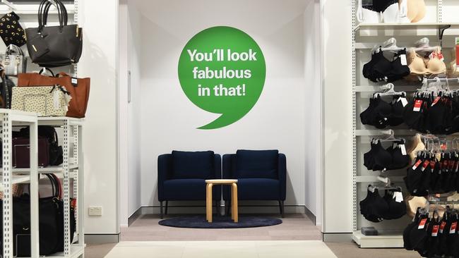 Tweed, NSW, Australia, January 12 2020: White Letters Of Harris Scarfe On A  Green Background Sign In A Shopping Centre. With Bright Lights And Clothes  On Display In The Store Stock Photo