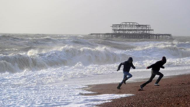 Waves crashing onto the beach in Brighton in East Sussex, southern England. Pic: AFP