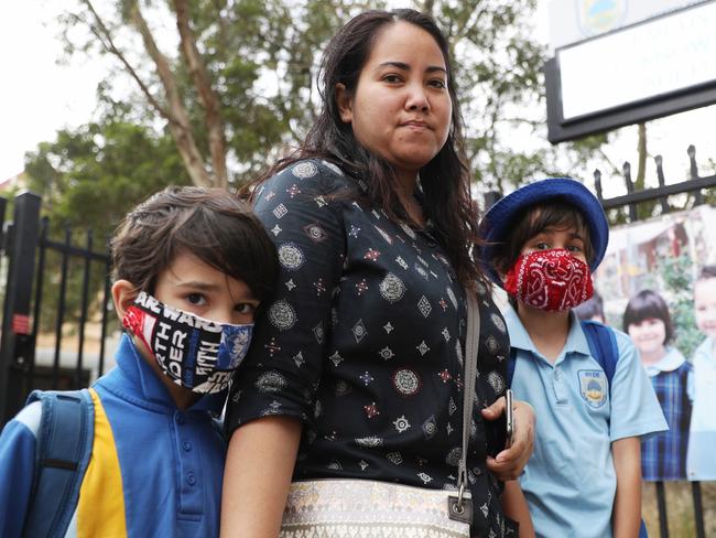 Australian schoolchildren Zane and Alex Ricardo with mum Fabia returning to school. Picture: John Grainger