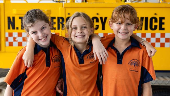 Elsie Burton (Year 5), Darcee McLachlan (Year 4) and Kaylee Mcgrady (Year 5) as Girraween Primary School students tour the NTES Palmerston Volunteer Unit, meeting Paddy the Platypus and testing out the emergency sirens. Picture: Pema Tamang Pakhrin