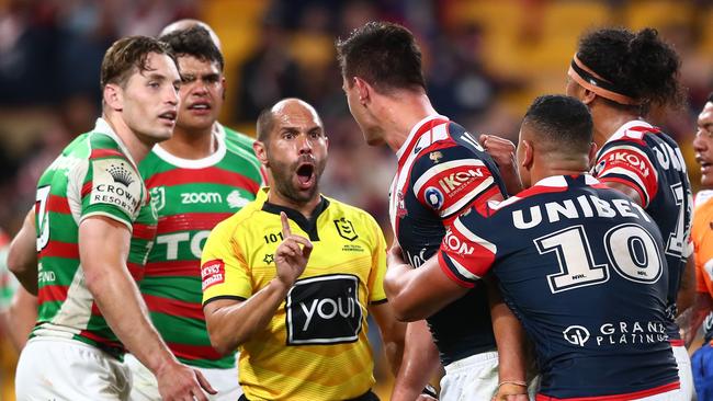 Referee Ashley Klein gets between Joey Manu and Latrell Mitchell. Picture: Chris Hyde/Getty