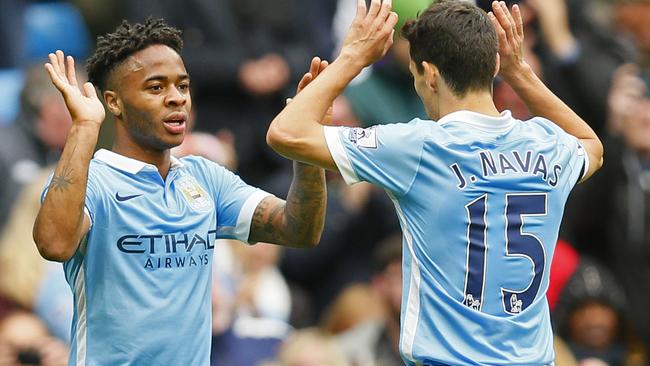 Football - Manchester City v AFC Bournemouth - Barclays Premier League - Etihad Stadium - 17/10/15 Manchester City's Raheem Sterling celebrates scoring their fourth goal and completing his hat-trick with Jesus Navas Action Images via Reuters / Jason Cairnduff Livepic EDITORIAL USE ONLY. No use with unauthorized audio, video, data, fixture lists, club/league logos or "live" services. Online in-match use limited to 45 images, no video emulation. No use in betting, games or single club/league/player publications. Please contact your account representative for further details.