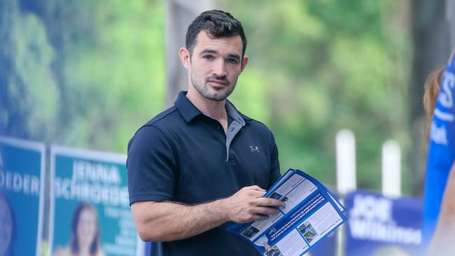 Murder-accused councillor Ryan Bayldon-Lumsden handing out how to vote material at Arundel State School. Picture: Glenn Campbell