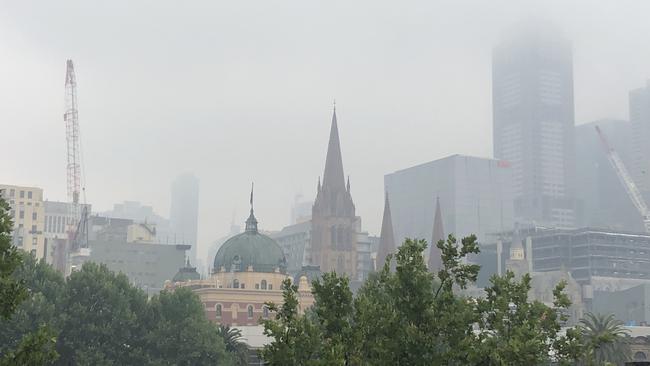 Smoke haze covers the top of Melbourne's skyscrapers.