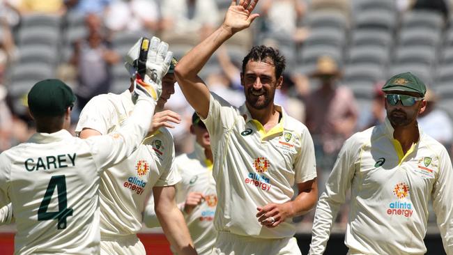 Australia's Mitchell Starc celebrates with teammates after taking the wicket of West Indies' Kyle Mayers. Picture: AFP