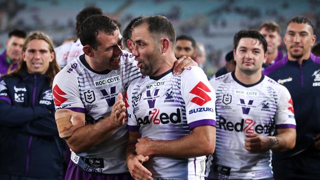 Dale Finucane and Cameron Smith celebrate another premiership.