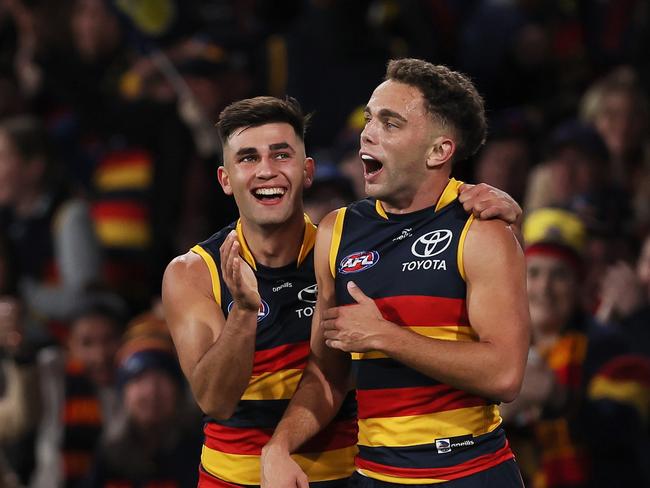 ADELAIDE, AUSTRALIA - MAY 02: Lachlan Sholl and Josh Rachele of the Crows celebrate a goal during the 2024 AFL Round 08 match between the Adelaide Crows and the Port Adelaide Power at Adelaide Oval on May 02, 2024 in Adelaide, Australia. (Photo by James Elsby/AFL Photos via Getty Images)