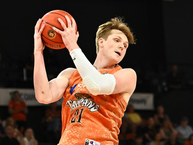 CAIRNS, AUSTRALIA - OCTOBER 19:  Sam Waardenburg  of the Taipans catches a rebound during the round five NBL match between Cairns Taipans and Illawarra Hawks at Cairns Convention Centre, on October 19, 2024, in Cairns, Australia. (Photo by Emily Barker/Getty Images)