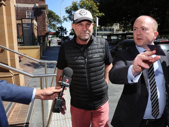 Australian cricketer Michael Slater leaving Manly courthouse in October 2021 with his solicitor James McLoughlin. Picture: Richard Dobson