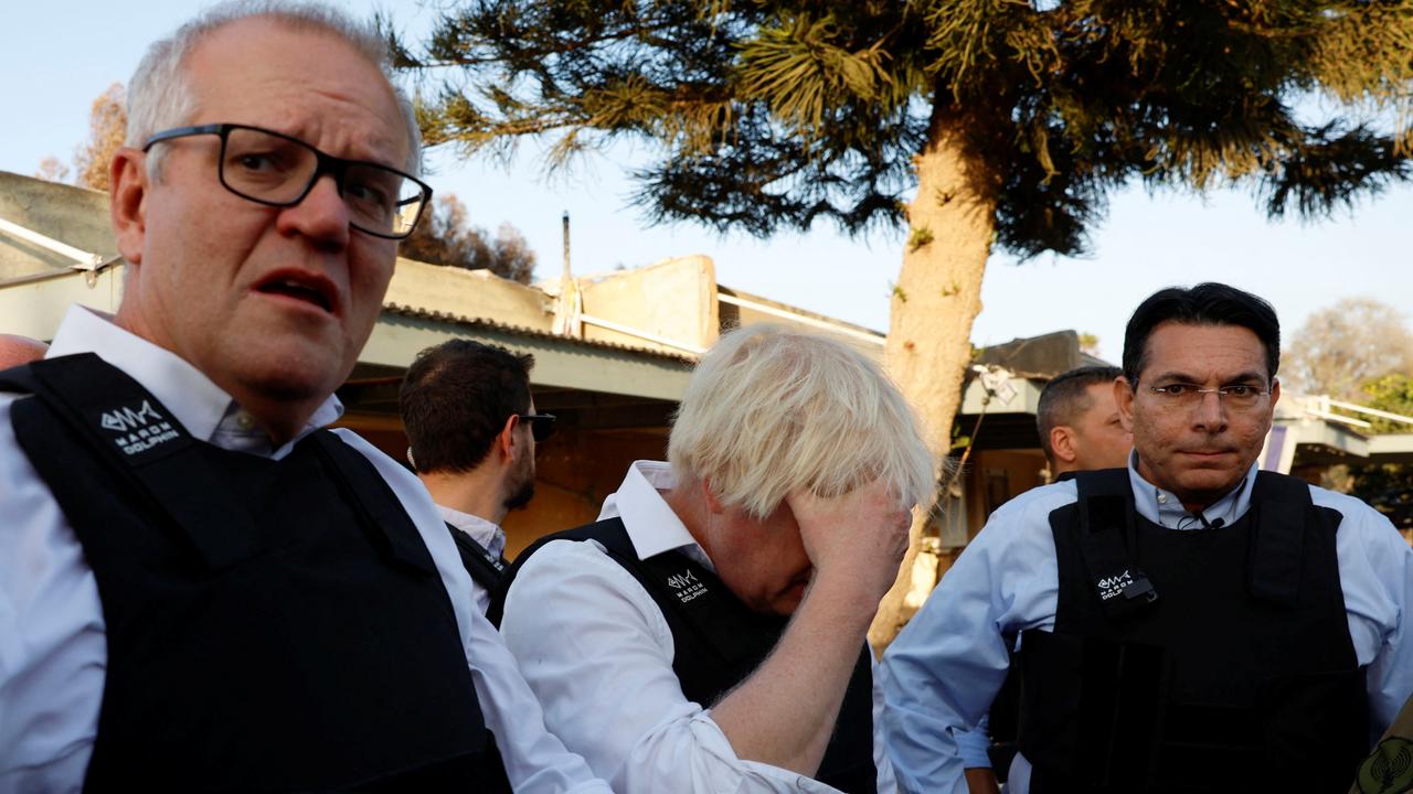 Former Prime Minister Scott Morrison and former British Prime Minister Boris Johnson visit Kibbutz Kfar Aza in southern Israel. Picture: Evelyn Hockstein/Reuters