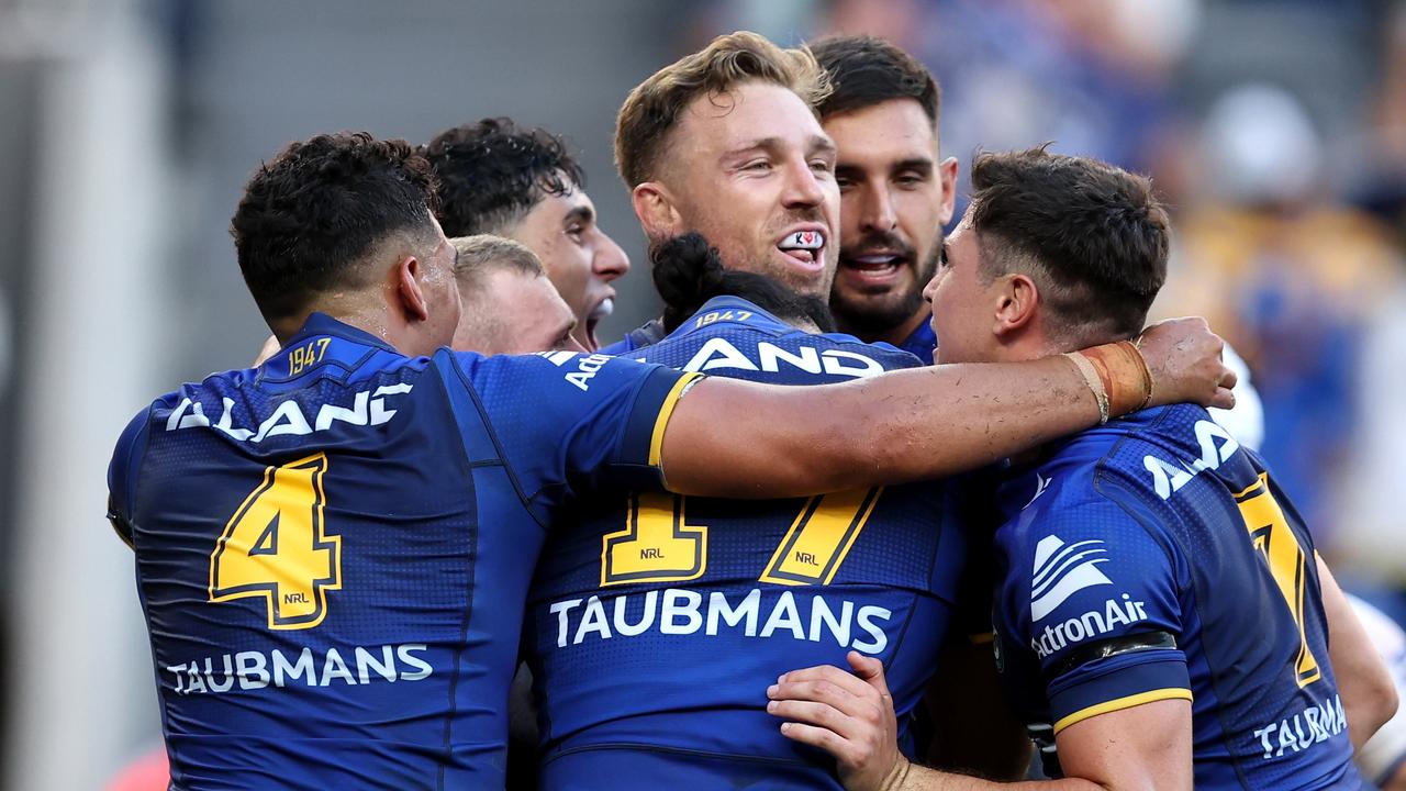 SYDNEY, AUSTRALIA - MARCH 09: Bryce Cartwright of the Eels celebrates celebrates with team mates after scoring a try during the round one NRL match between Parramatta Eels and Canterbury Bulldogs at CommBank Stadium, on March 09, 2024, in Sydney, Australia. (Photo by Brendon Thorne/Getty Images)