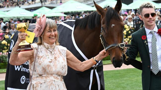 MELBOURNE, AUSTRALIA - NOVEMBER 09:  Melbourne Cup winning Co trainers Sheila Laxon and John Symons, jockey Robbie Dolan and connections pose with Knight's Choice during Champion Stakes Day at Flemington Racecourse on November 09, 2024 in Melbourne, Australia. (Photo by Vince Caligiuri/Getty Images)