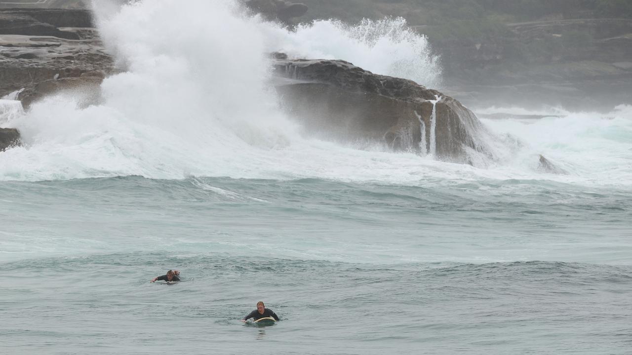 Surfers enjoying large swells at Bronte Beach, NSW. Picture: NCA NewsWire / Dylan Coker