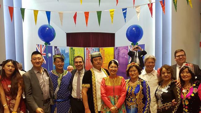 Jing Lee, centre, poses with then-Opposition Leader, Premier Steven Marshall, and now-education minister John Gardiner at an SA Xinjiang Association function in November 2016.