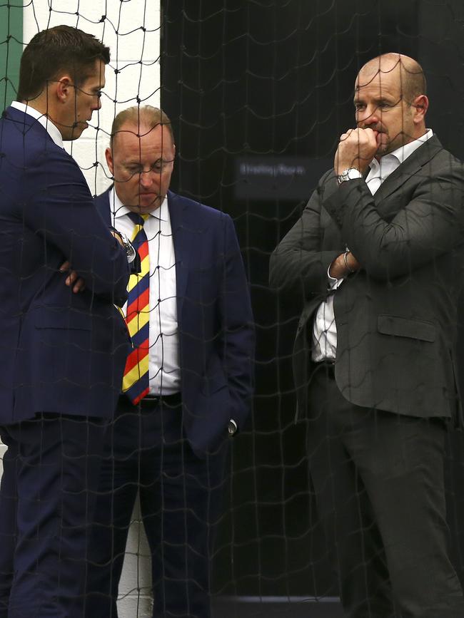 Crows CEO Andrew Fagan, chairman Rob Chapman and board member Mark Ricciuto in the rooms after the 2017 grand final loss. Picture: Sarah Reed