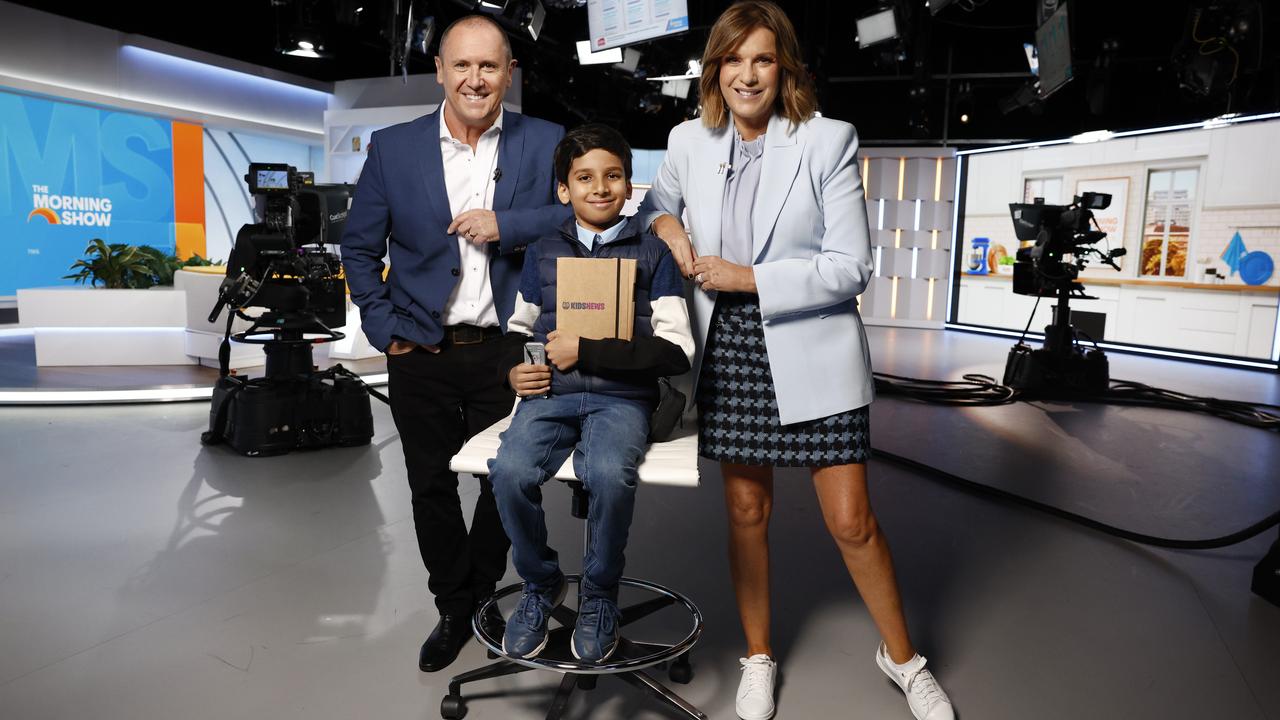 The Morning Show hosts Larry Emdur and Kylie Gillies with 2023 Junior Journalist category winner Adit Garg, 10, launch the Kids News Junior Journo Newsroom and 2024 competition in Sydney. They were joined from the Melbourne studio by reigning Junior Journalist of the Year Madison Riquelme, 13. Picture: Richard Dobson