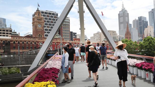 Victorians will no longer be required to wear masks outdoors. Picture: David Crosling