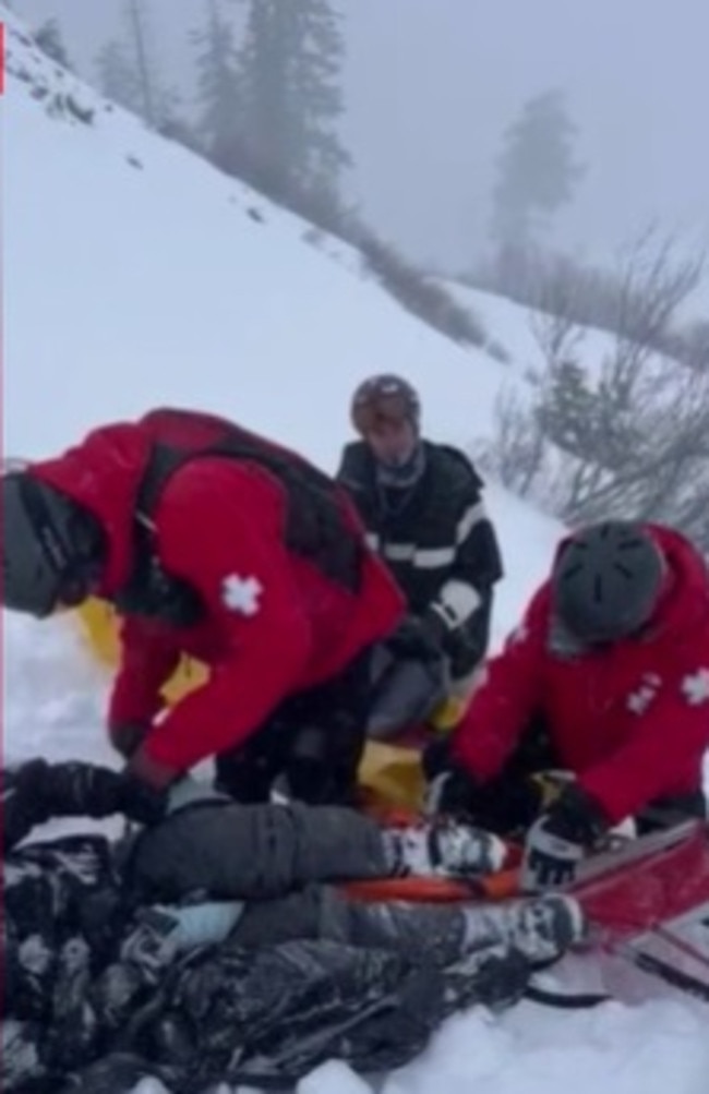 Oliver had to be sled down the mountain for medical treatment. Picture: Nine News