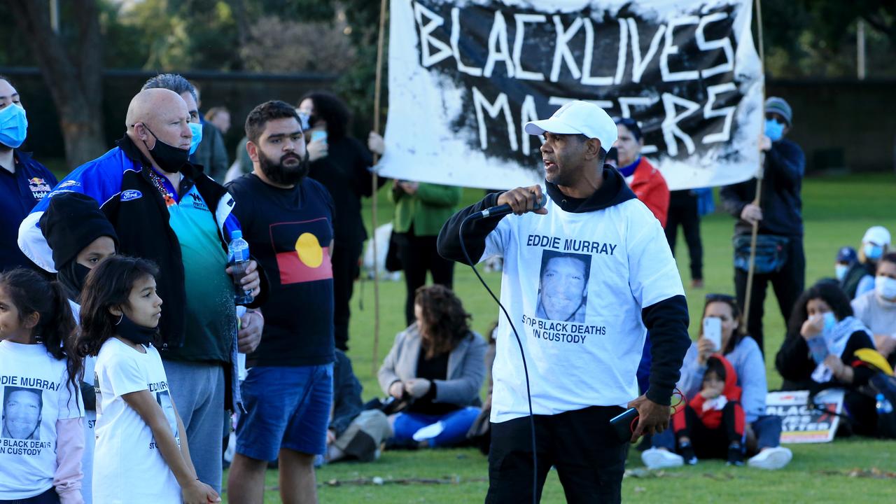 A man wears a shirt showing a photo of former rugby league player Eddie Murray, who died less than an hour after being taken into police custody in 1981. Police claimed he hung himself. A 1997 autopsy suggested he really died from a sternum fracture. Picture: Damian Shaw