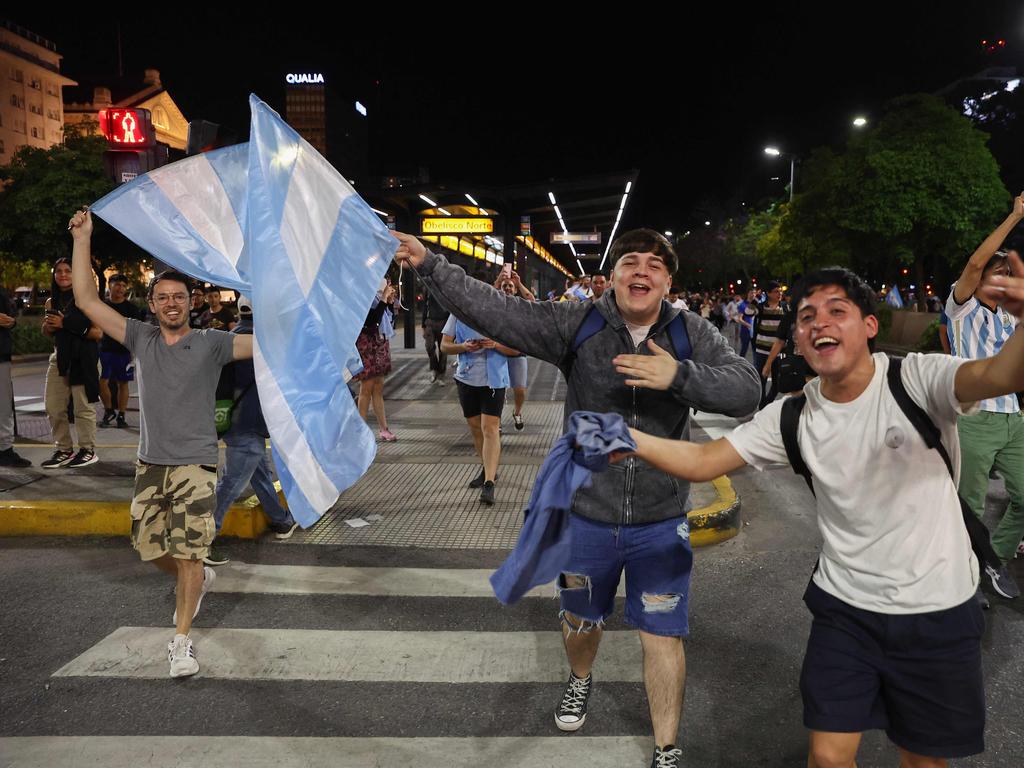 Supporters of the Argentine presidential candidate for the La Libertad Avanza alliance, Javier Milei, celebrate his victory in the presidential election.