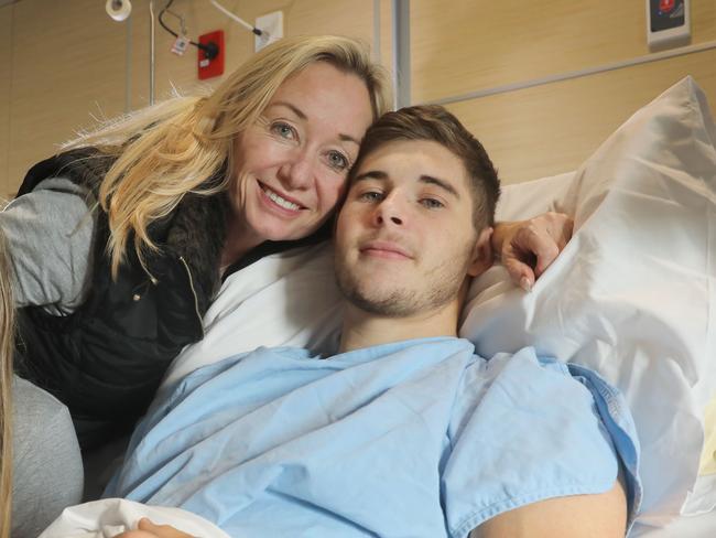 Sturt footballer, Blake Kennedy, 22, in the RAH after damaging his kidney and lung playing against North Adelaide. Pictured with his mum Michele and sister Amy, who live in Queensland. AT RAH 13 July 2018. Pic. Dean Martin