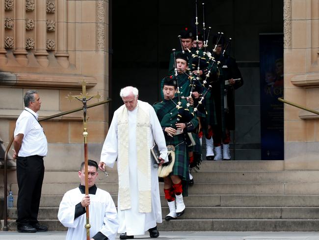 The procession leaves the church after the service. Picture: Toby Zerna