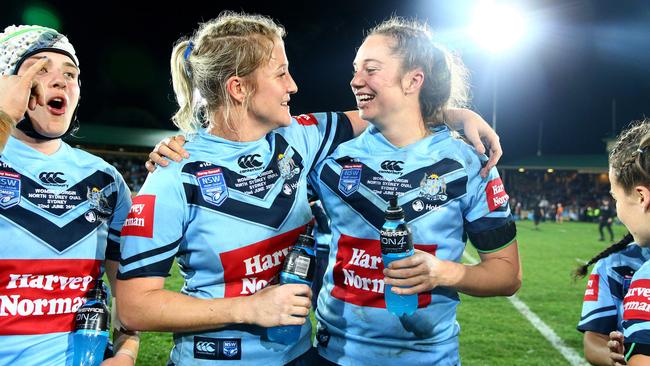 Talesha Quinn and Kezzie Apps celebrate winning the women's State of Origin game. Picture: Adam Head