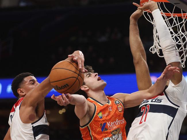 WASHINGTON, DC - OCTOBER 10: Taran Armstrong #2 of the Cairns Taipans has his shot blocked by Johnny Davis #1 of the Washington Wizards during the first half of a preseason game at Capital One Arena on October 10, 2023 in Washington, DC. NOTE TO USER: User expressly acknowledges and agrees that, by downloading and or using this photograph, User is consenting to the terms and conditions of the Getty Images License Agreement.   Patrick Smith/Getty Images/AFP (Photo by Patrick Smith / GETTY IMAGES NORTH AMERICA / Getty Images via AFP)