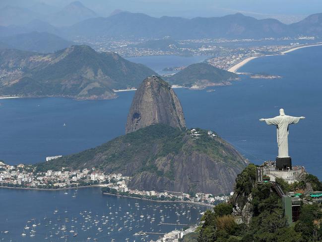 epa05374234 (FILE) A file photo date February 2014 showing an aerial view of the 'Christ the Redeemer' statue overlooking Rio de Janairo, Brazil. A serious financial crisis facing the state of Rio de Janeiro propelled Rio's interim governor Francisco Dornelles, to declare a state of public calamity on 17 June 2016 to fulfil its Olympic commitments. The 2016 Olympic Games in Rio de Janeiro will start on 05 August and run until 21 August 2016.  EPA/MARCELO SAYAO *** Local Caption *** 51564077