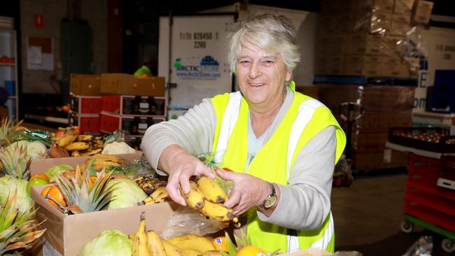 Barbara Wilde prepares a food parcel for delivery in Penrith.