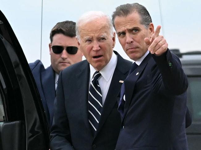 TOPSHOT - US President Joe Biden talks with his son Hunter Biden upon arrival at Delaware Air National Guard Base in New Castle, Delaware, on June 11, 2024, as he travels to Wilmington, Delaware. A jury found Hunter Biden guilty on June 11 on federal gun charges in a historic first criminal prosecution of the child of a sitting US president. The 54-year-old son of President Joe Biden was convicted on all three of the federal charges facing him, CNN and other US media reported. (Photo by ANDREW CABALLERO-REYNOLDS / AFP)