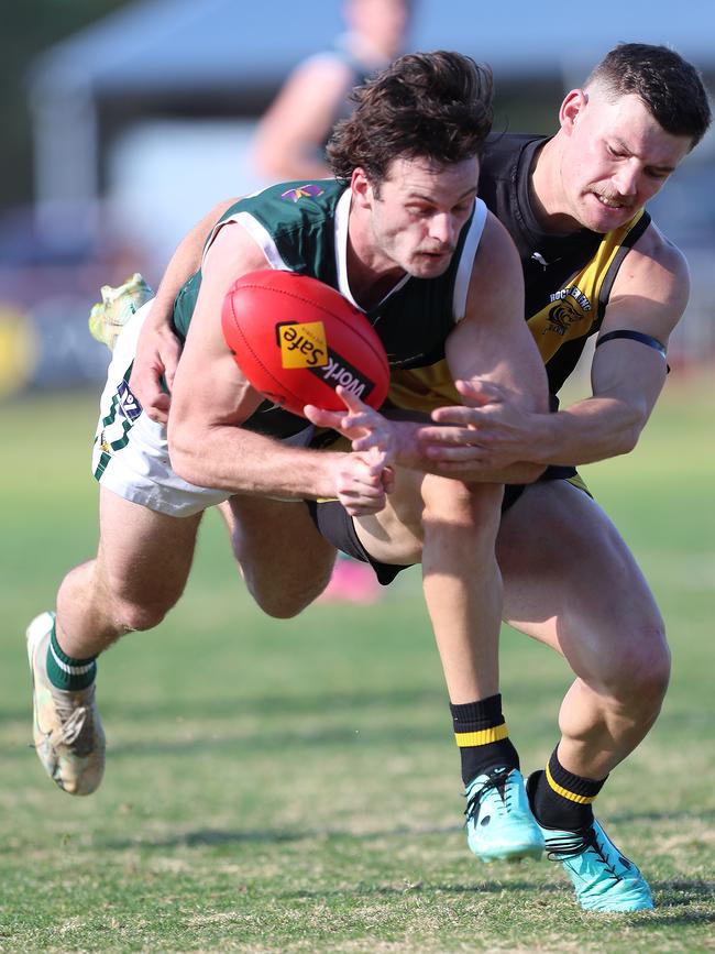 Rochester’s Grant Fuller tries to stop Echuca’s Jack McHale.