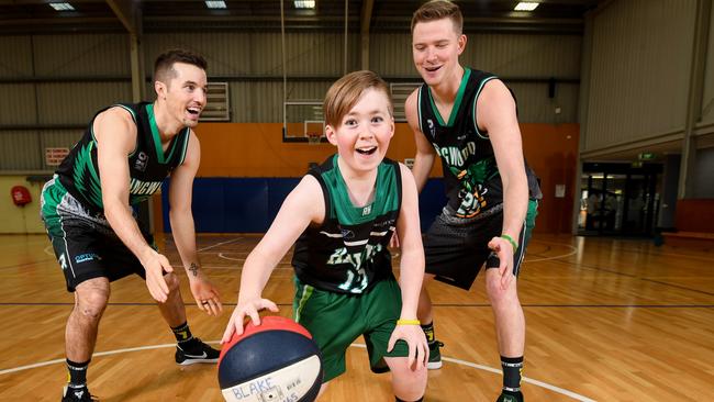 Brady Cochrane is all smiles hitting the court with Ringwood Hawks Joey Miller and Jacob Gibson. Picture: Penny Stephens