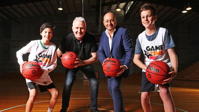 Australian basketball legend Andrew Gaze and NBL owner Larry Kestelman alongside Tasmanian basketball juniors Harrison Baker, 13 of Bonnet Hill, and Jeriah Webb, 12, of Kingston, as the NBL announced that the NBL Blitz will be heading to Tasmania in September. Picture: ZAK SIMMONDS