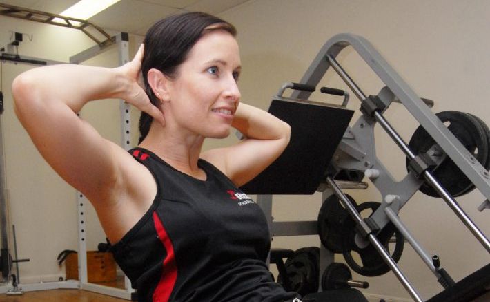 Red E Personal Trainer Selina Wright doing sit ups on a fitball. . Picture: Tony Martin