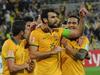 Australia's Mathew Leckie (L) congratulates Mile Jedinak (C) and Tim Cahill (R) after a goal during the first round Asian Cup football match between Australia and Kuwait in Melbourne on January 9, 2015. AFP PHOTO / MAL FAIRCLOUGH IMAGE RESTRICTED TO EDITORIAL USE - STRICTLY NO COMMERCIAL USE