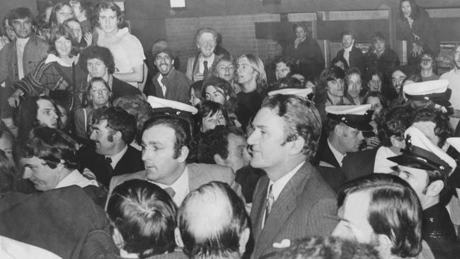 The thick of it: Monash University protesters and security personnel surround then-Prime Minister Malcolm Fraser in 1976.