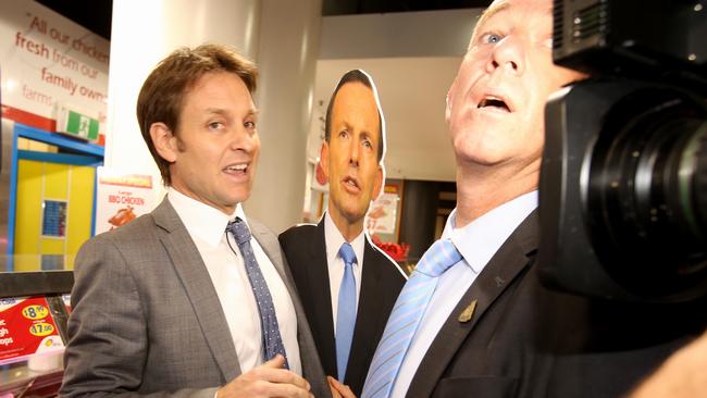 Craig Reucassel is held back by security as he followed Malcolm Turnbull around with a Tony Abbott cardboard cutout.<i/>Picture: Stephen Cooper