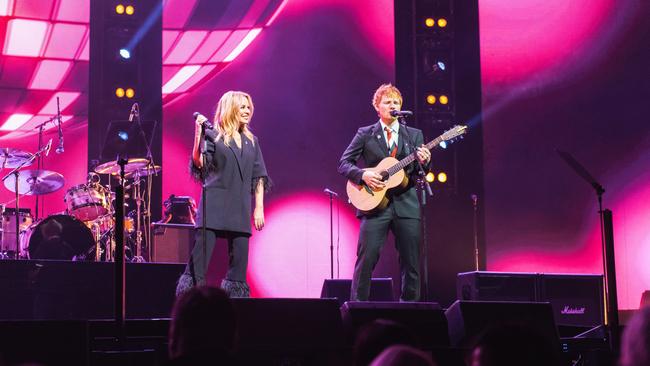 Kylie Minogue and Ed Sheeran play a tribute song to Michael Gudinski at the state memorial service: The Loco-Motion. Picture Mushroom Creative House.