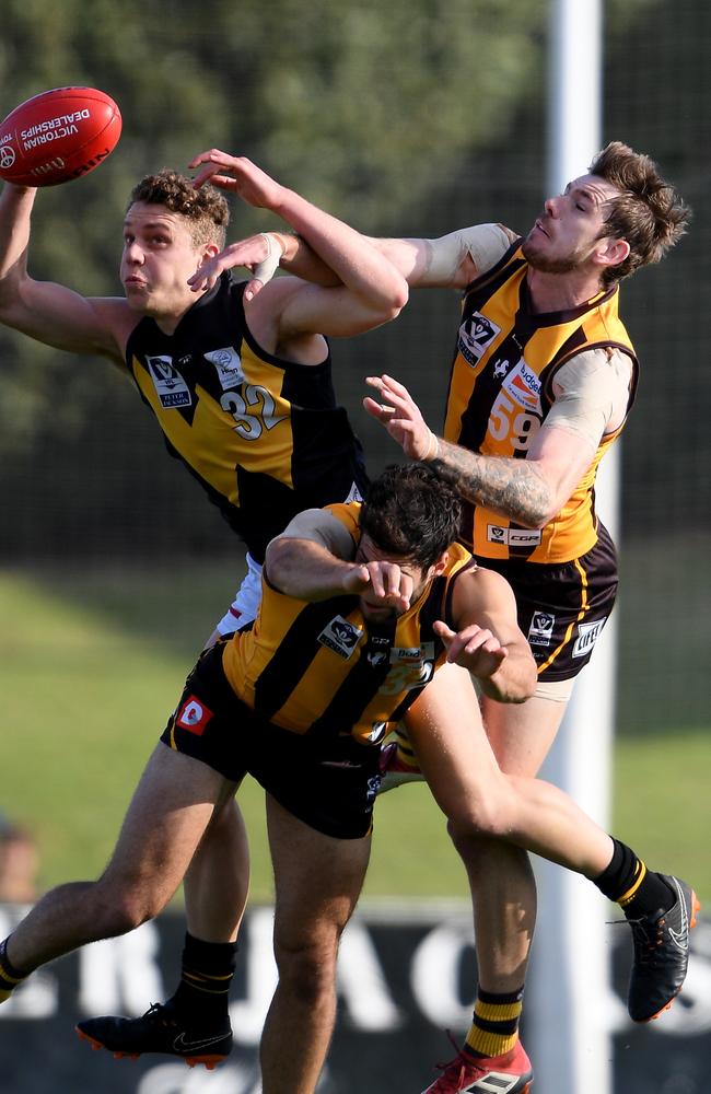 Josh Corbett springing for a mark against Box Hill Hawks at the City Oval.