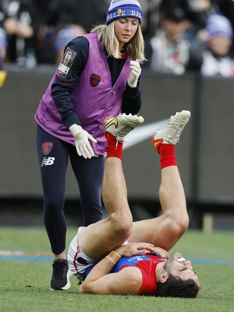 Petracca lays prone after being collected by Moore. Picture: Michael Klein