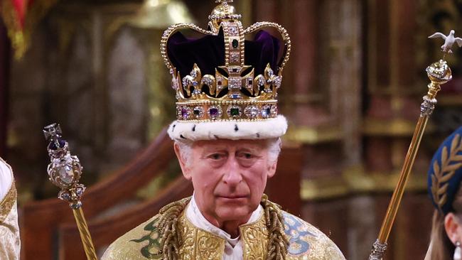 LONDON, ENGLAND - MAY 06:  King Charles III stands after being crowned during his coronation ceremony in Westminster Abbey, on May 6, 2023 in London, England. The Coronation of Charles III and his wife, Camilla, as King and Queen of the United Kingdom of Great Britain and Northern Ireland, and the other Commonwealth realms takes place at Westminster Abbey today. Charles acceded to the throne on 8 September 2022, upon the death of his mother, Elizabeth II. (Photo by Richard Pohle - WPA Pool/Getty Images)