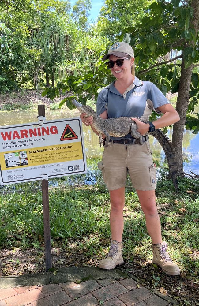 Wildlife officer Ella Meeve a saltwater crocodile captured near Ingham State High School. Picture: Supplied