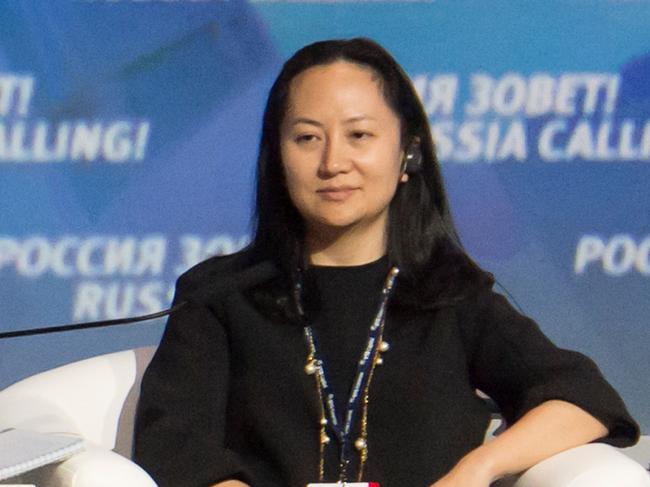 Russia's President Vladimir Putin (L) and Meng Wanzhou, Executive Board Director of the Chinese technology giant Huawei, attend a session of the VTB Capital Investment Forum "Russia Calling!" in Moscow, Russia October 2, 2014. Picture taken October 2, 2014. REUTERS/Alexander Bibik - RC1E784C06A0