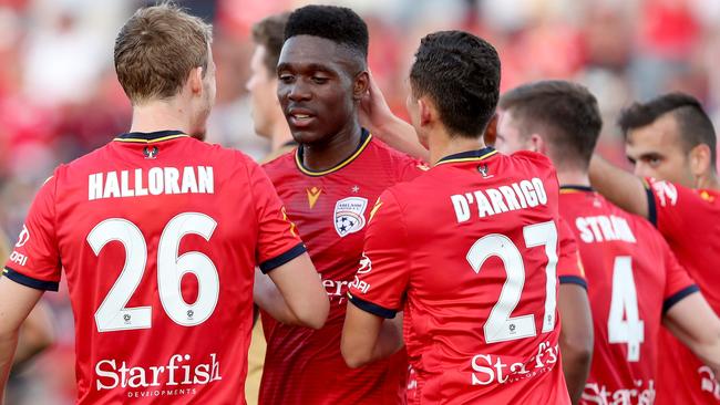 Adelaide’s Al Hassan Toure, second from left, appears unlikely to play again this season due to a foot injury. Picture: AAP