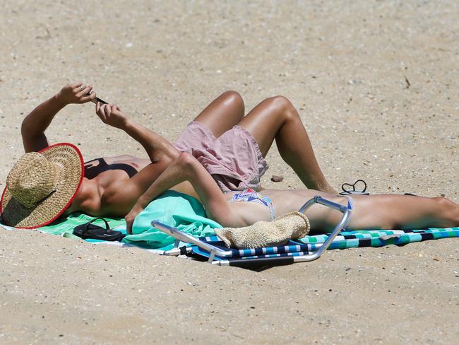 Melburnians take to the beach. Picture: Ian Currie
